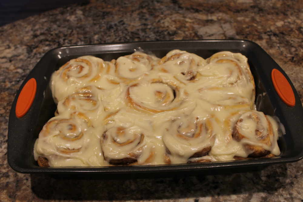 Homemade cinnamon rolls with cream cheese frosting.