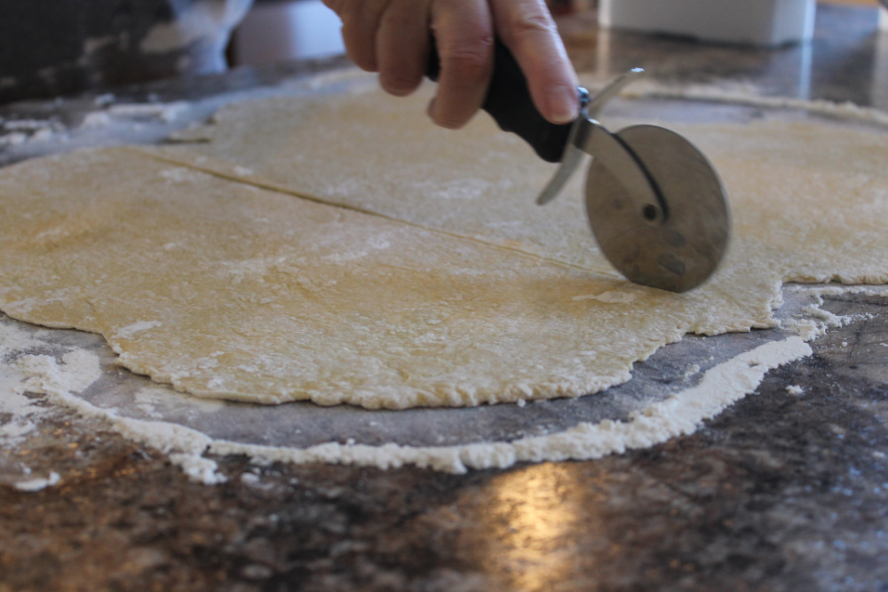 Use a pizza cutter to cut up noodle dough