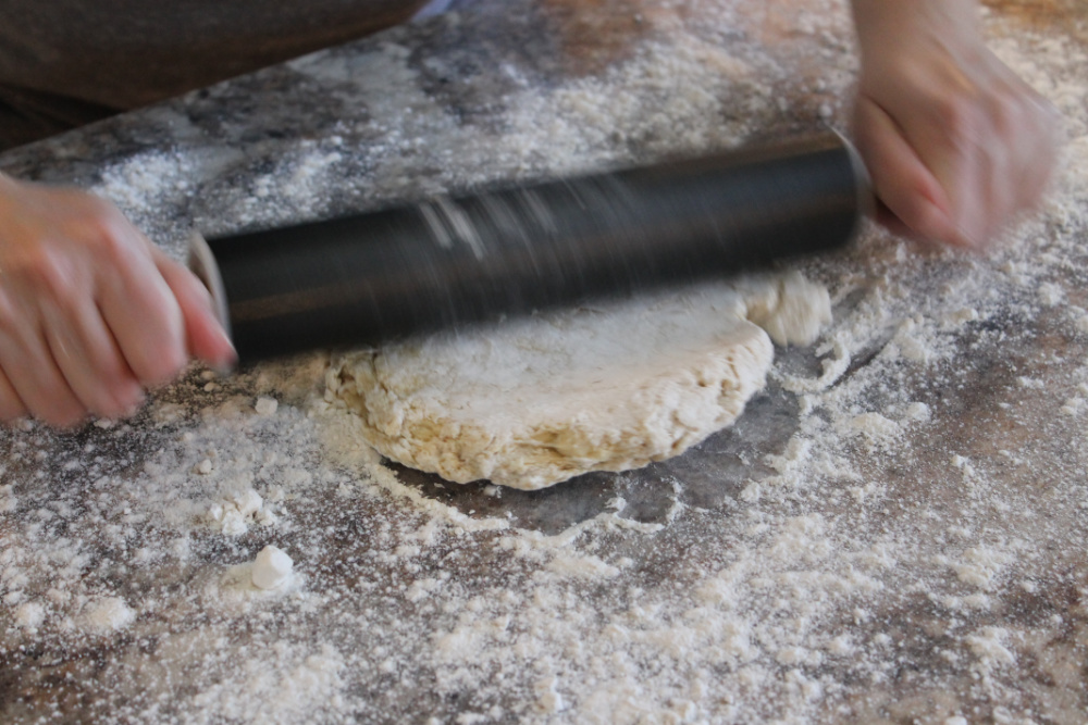 Rolling out homemade noodle dough